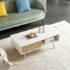 White rattan coffee table storage compartment open